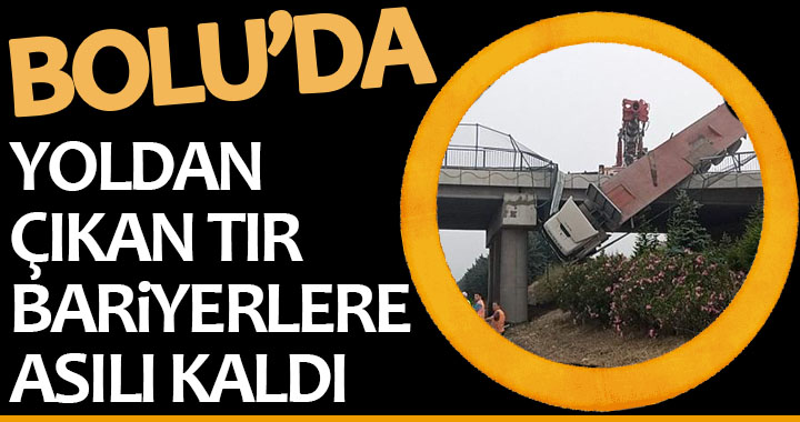 YOLDAN ÇIKAN TIR BARİYERLERE ASILI KALDI!